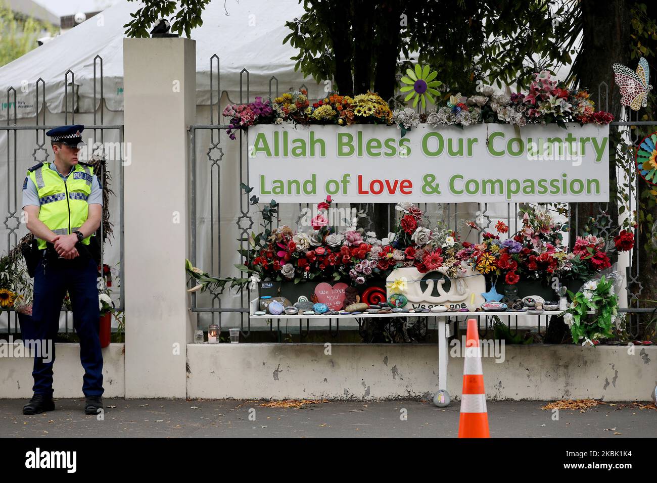 A police officer stands guard outside the Al Noor mosque in Christchurch, New Zealand on March 15, 2020. On March 15 last year, 51 people died and 49 were injured in the shootings at Christchurch's Al Noor and Linwood MosquesÂ when a gunman opened fire on worshippers.Â It was labeled as New Zealand's 'darkest day'.Â Events around the country including the Christchurch National Remembrance Service which marking the first anniversary of the attacks has been canceled amid safety fears over Covid-19.Â (Photo by Sanka Vidanagama/NurPhoto) Stock Photo