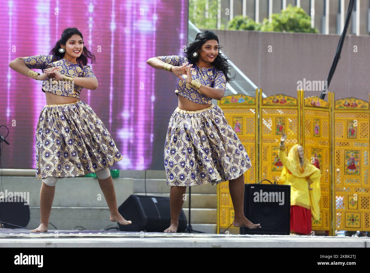 Indian dancers perform a Bollywood dance during the Taste of India food festival at Nathan Philips Square in Toronto, Ontario, Canada, on August 04, 2019. The festival showcased food vendors offering tasty and exotic delicacies and a variety of street food from across India. (Photo by Creative Touch Imaging Ltd./NurPhoto) Stock Photo