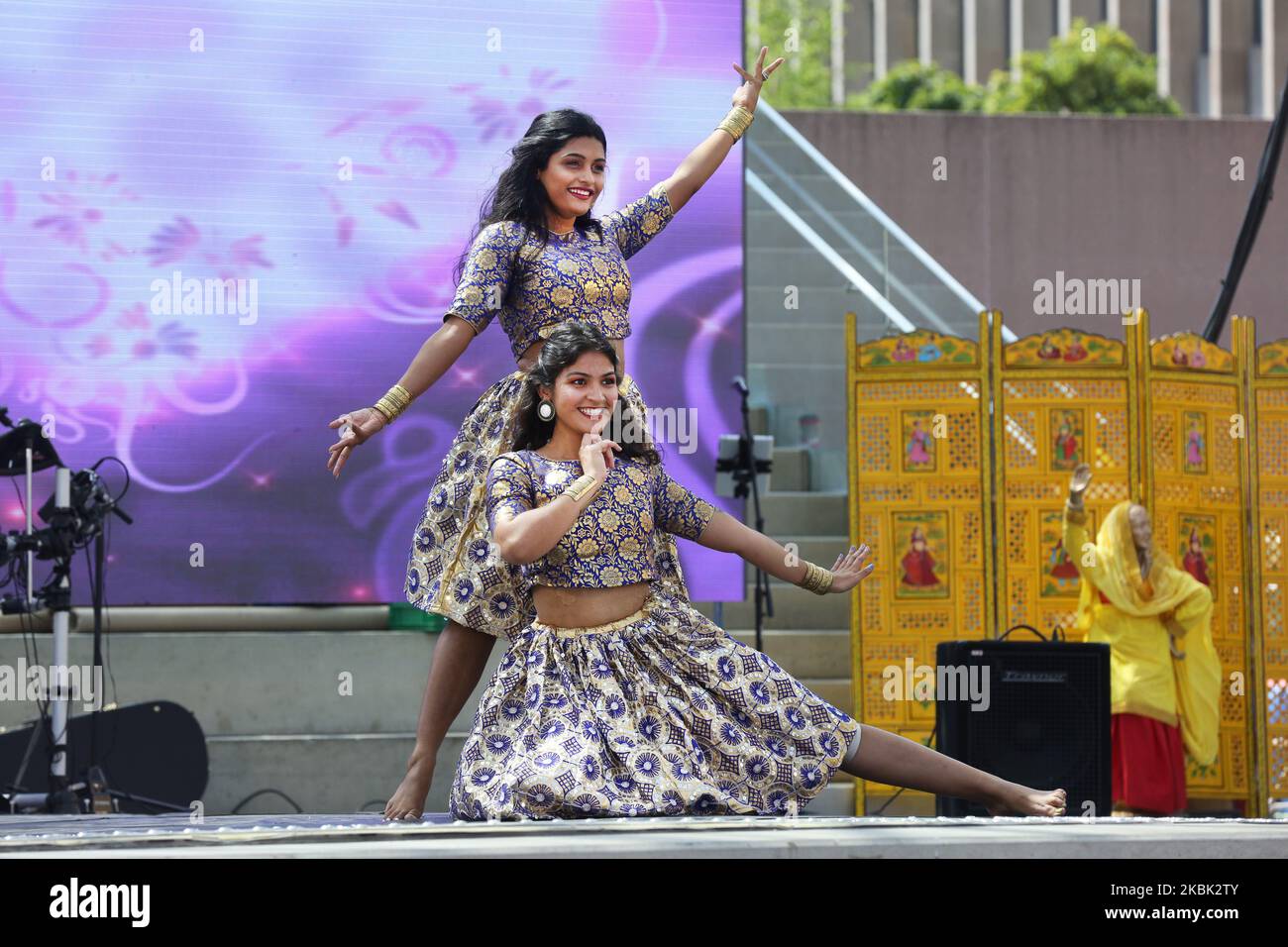 Indian dancers perform a Bollywood dance during the Taste of India food festival at Nathan Philips Square in Toronto, Ontario, Canada, on August 04, 2019. The festival showcased food vendors offering tasty and exotic delicacies and a variety of street food from across India. (Photo by Creative Touch Imaging Ltd./NurPhoto) Stock Photo