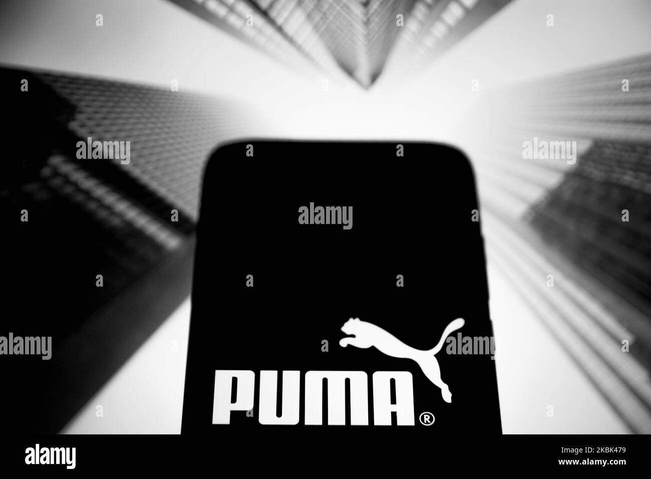 (EDITOR'S NOTE: This image has been converted to black and white.) In this photo illustration a Puma logo is displayed on a smartphone on March 16, 2020 in Athens, Greece. (Photo by Nikolas Kokovlis/NurPhoto) Stock Photo