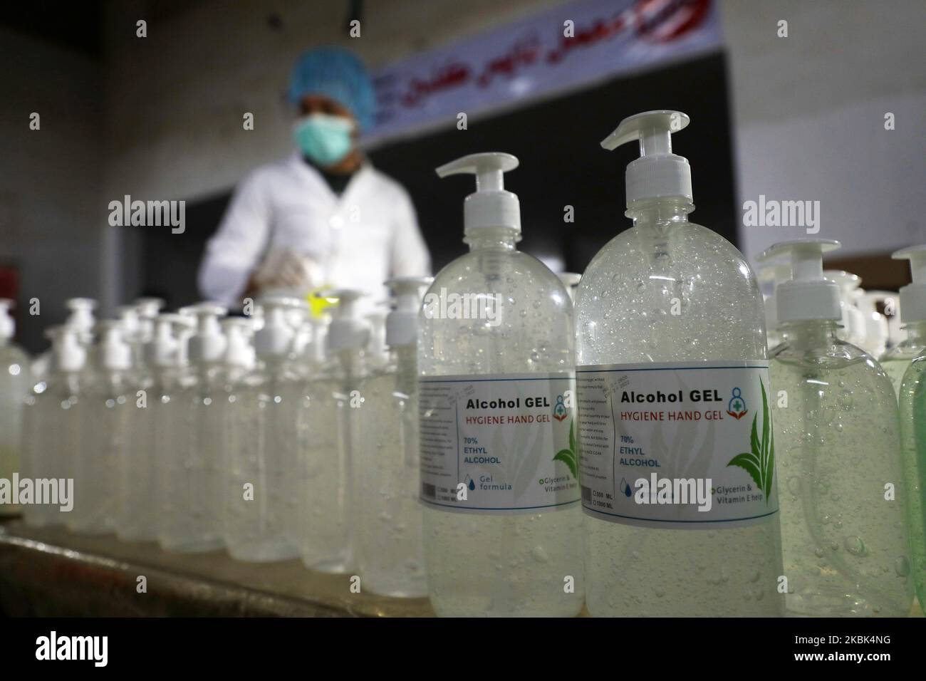 Palestinian workers work on the production line of sterilizing gel at a cleaning materials factory in the southern Gaza Strip city of Rafah, March 17, 2020. Gaza authorities declared a new set of precautionary measures amid concerns about the spread of the novel coronavirus in the coastal enclave. (Photo by Majdi Fathi/NurPhoto) Stock Photo