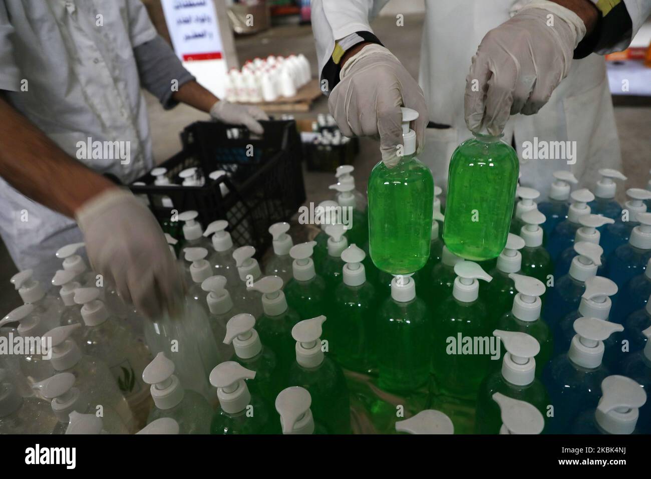 Palestinian workers work on the production line of sterilizing gel at a cleaning materials factory in the southern Gaza Strip city of Rafah, March 17, 2020. Gaza authorities declared a new set of precautionary measures amid concerns about the spread of the novel coronavirus in the coastal enclave. (Photo by Majdi Fathi/NurPhoto) Stock Photo