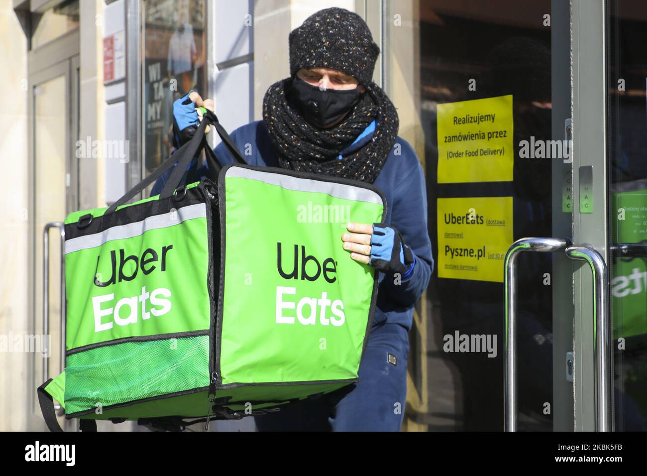 Uber Eats Delivery Bike Driver Is Picking Up An Order From McDonald s uber-eats-delivery-bike-driver-is-picking-up-an-order-from-mcdonald-s
