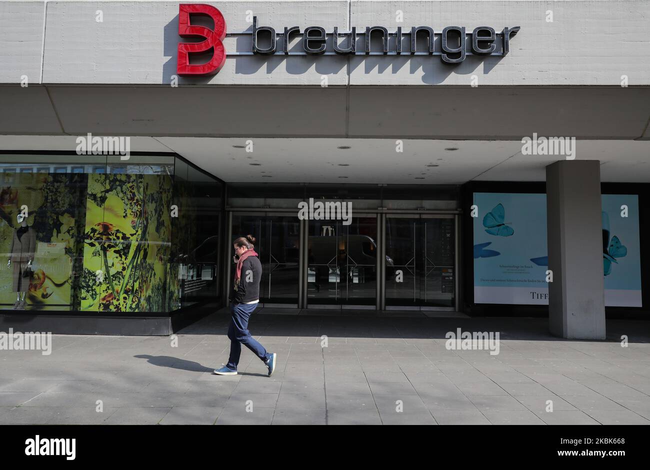 People walk in front of closed stores at the center of Stuttgart, southern Germany on March 18, 2020. German leaders urged citizens to stay home, as the government announced unprecedented nationwide measures to radically scale back public life in order to slow the spread of the coronavirus. (Photo by Agron Beqiri/NurPhoto) Stock Photo