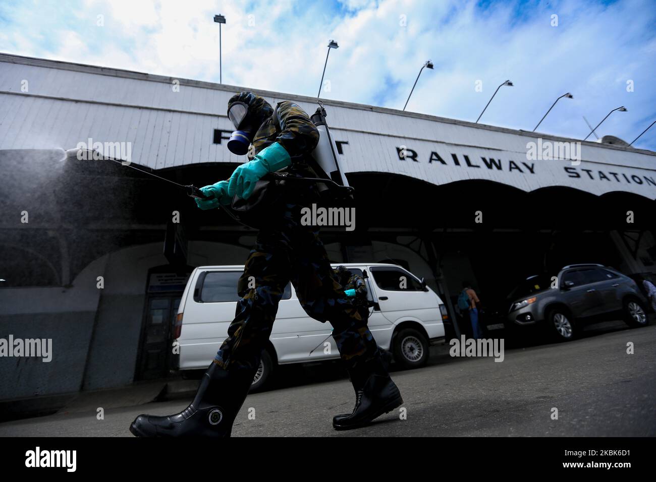 Sri Lankan Air Force officers spray disinfectant liquid at the main railway station at Fort in Colombo, Sri Lanka on March 18, 2020. Sri Lanka have 50 Covid-19 (Corona Virus) positive cases so far according to Sri Lanka's Director General of Health Services, Dr. Anil Jasinghe. Sri Lankan Police Spokesman said that the Sri Lankan government decided to impose police curfew in the Puttalam District and Kochchikade Police Division in Negombo on 18 March 2020 to curb the spread of Covid-19 virus. (Photo by Tharaka Basnayaka/NurPhoto) Stock Photo