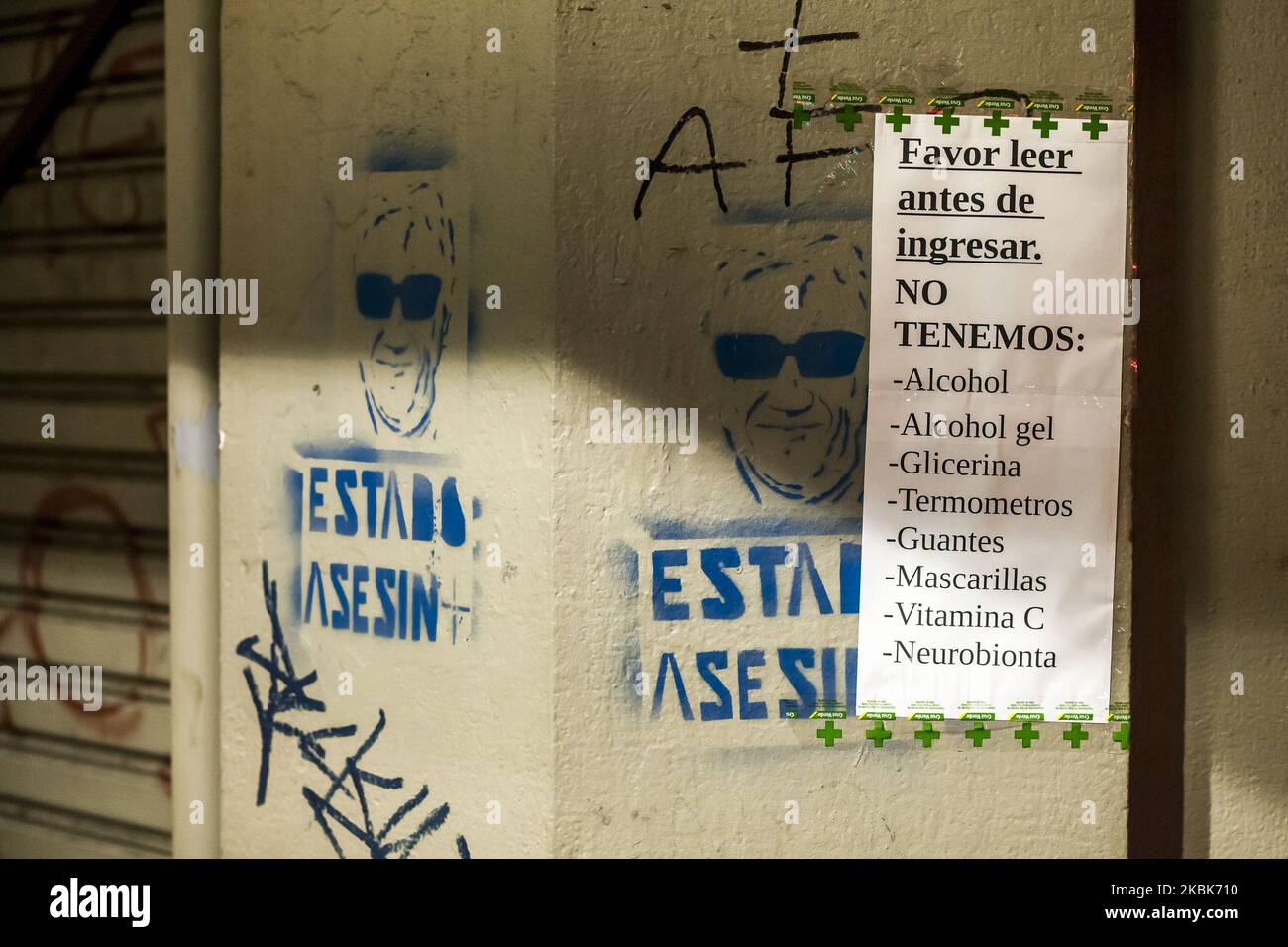 Sign affixed to the exterior of the facade of a pharmacy indicating the lack of hygiene products, in Osorno, Chile, on March 18, 2020. On one side a stencil with the face of Sebastian Pinera. President Sebastian Pinera decreed a state of catastrophe throughout Chile for ninety days before the advance of Covid-19, this measure is in effect from 00:00 on Thursday, March 19. The President has the exceptional powers to restrict: the freedoms of locomotion and assembly; arrange requisitions of goods; establish limitations to the exercise of the property right; and, adopt all the extraordinary admin Stock Photo