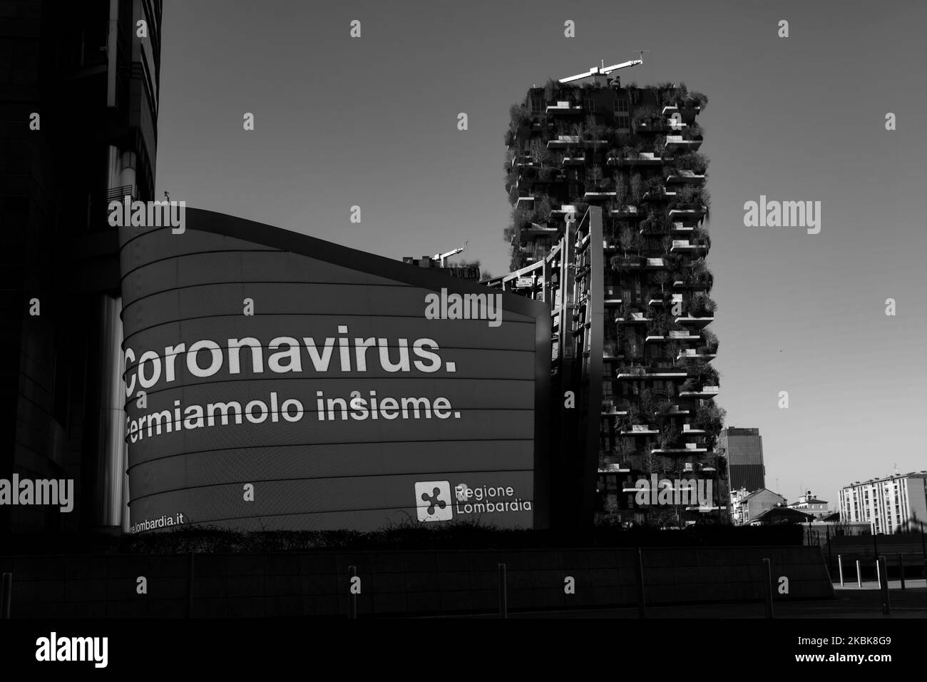 (EDITOR'S NOTE: This image has been converted to black and white.) General view of Gae Aulenti Square and Bosco Verticale (vertical forest), March 19, 2020 in Milan, Italy. The Italian Government has strengthened up its quarantine rules, shutting all commercial activities except for pharmacies, food shops, gas stations, tobacco stores and news kiosks in a bid to stop the spread of the novel coronavirus. (Photo by Mairo Cinquetti/NurPhoto) Stock Photo