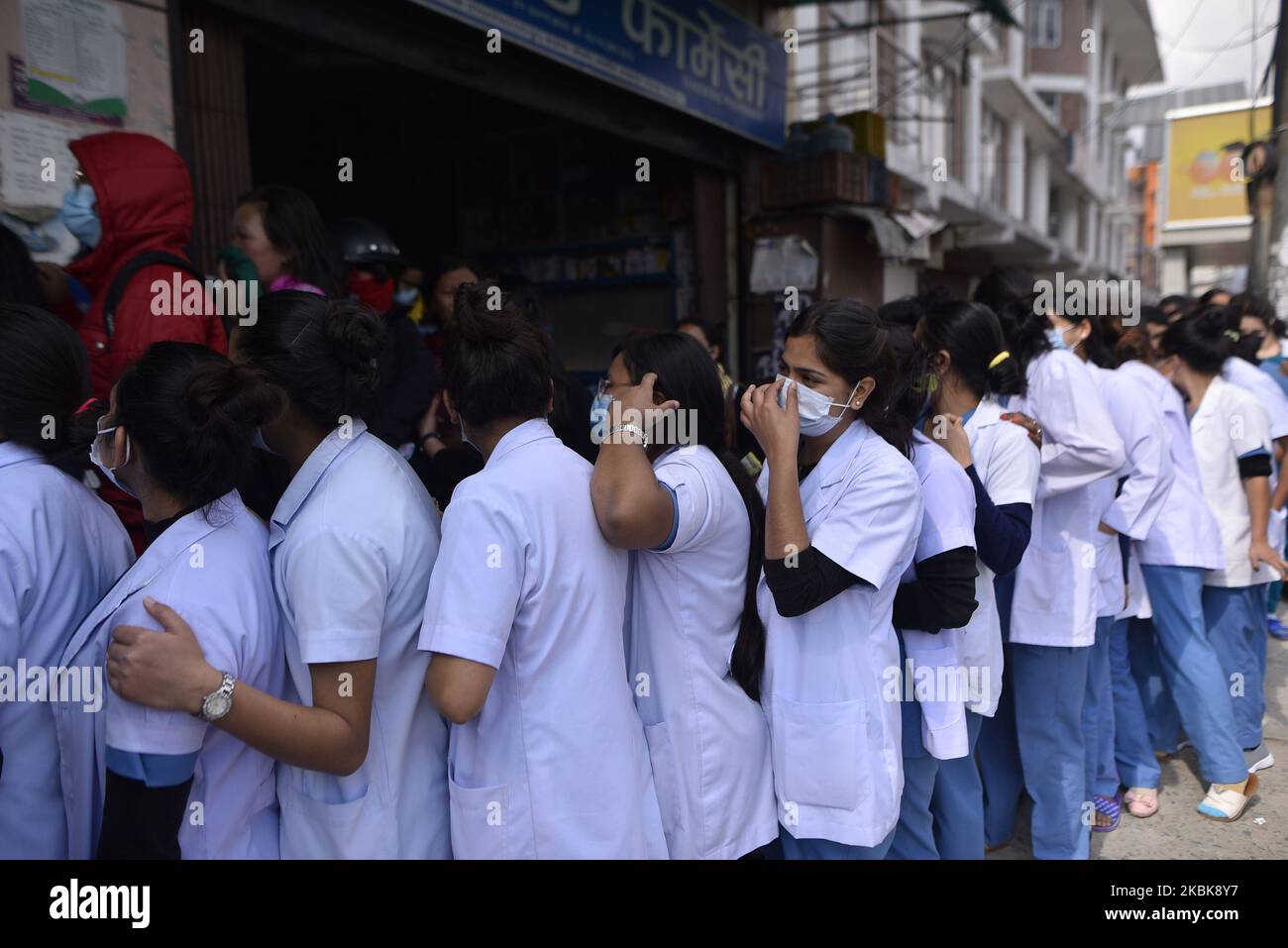 Nepalese Nurse and Doctors lining to buy surgical masks from the Sajha Shwashthya Sewa, a