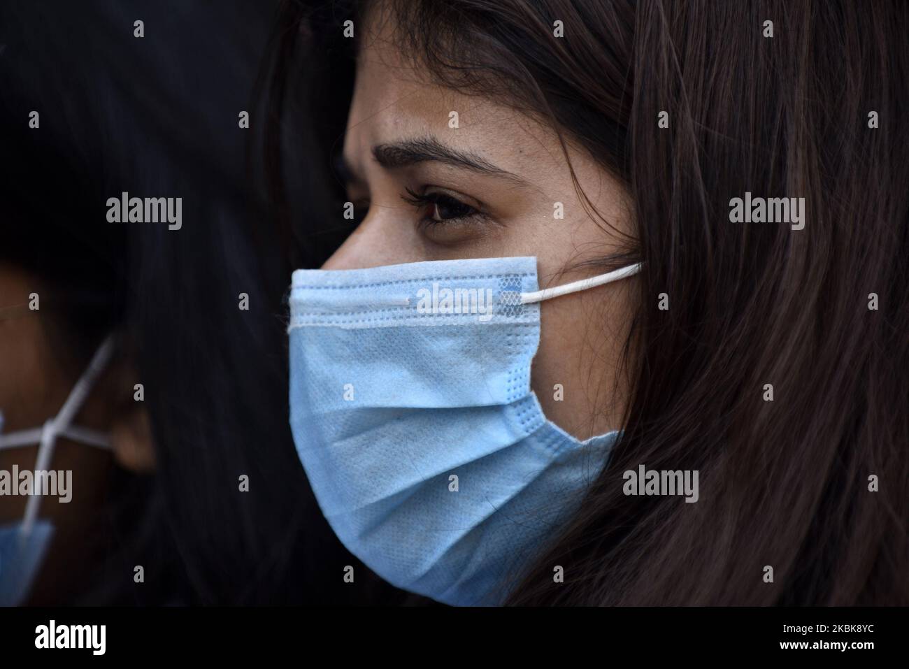 A Portrait of Nepalese people lining to buy surgical masks from the Sajha Shwashthya Sewa, a