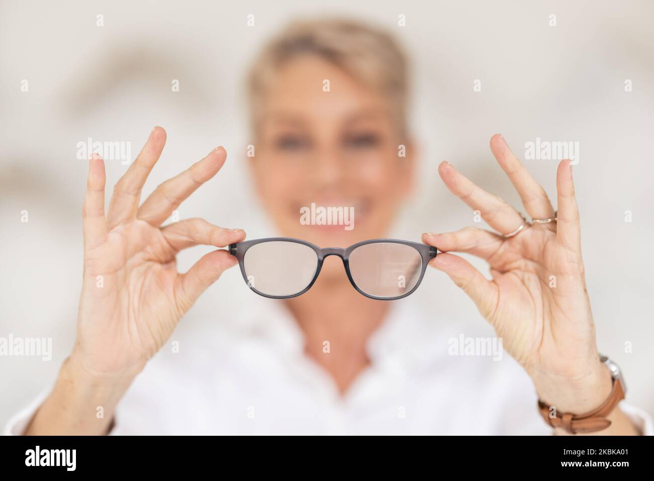 Vision, eyesight and glasses in hands with blur, woman has poor eye