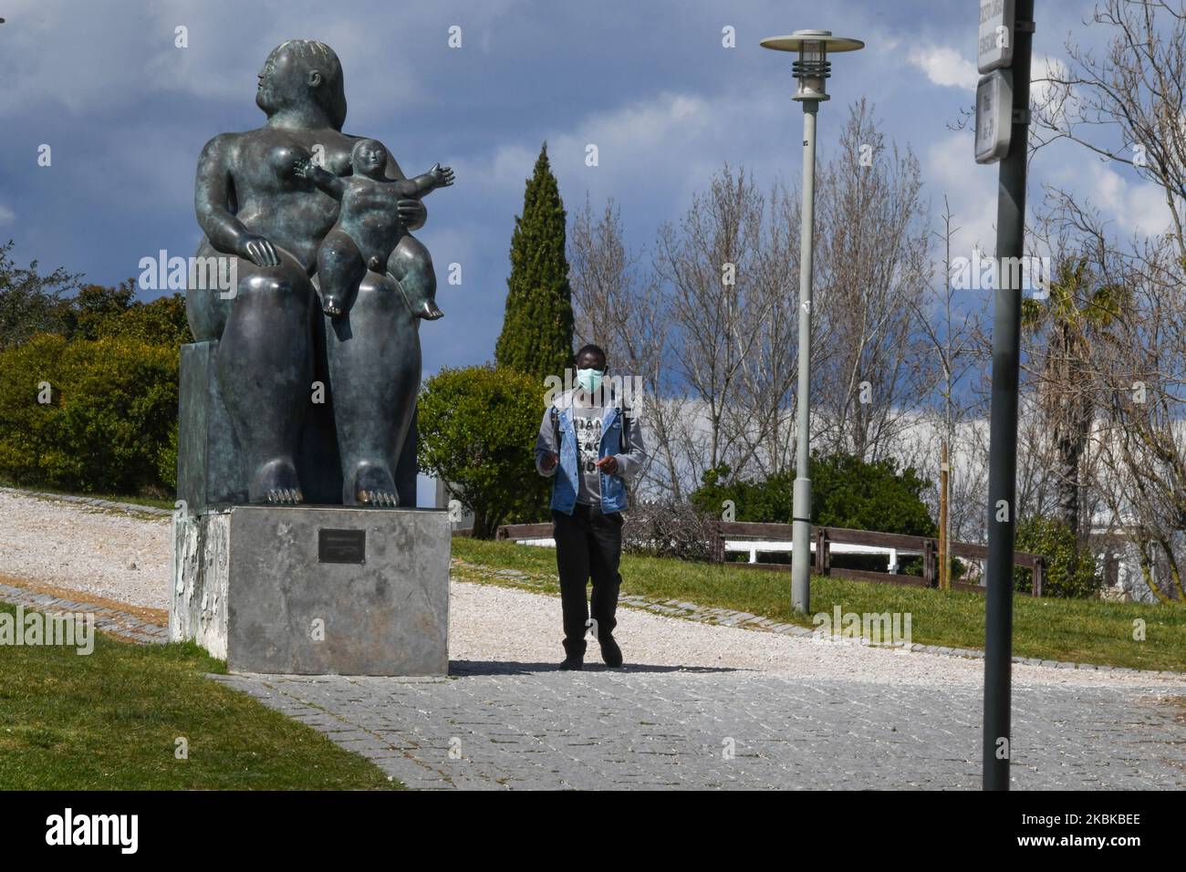 A man wearing a protective mask walks near La Maternidad (Maternity) this March 21 in Lisbon, Portugal, on March 21, 2020. Despite the efforts made by the Portuguese government to reduce the number of people affected by the COVID-19 virus, with 1300 cases and 12 deaths, the civilian population continues to fail to comply with the quarantine plans imposed this Wednesday, March 18, when the Presidency of the Republic declared the country a national. (Photo by Jorge Mantilla/NurPhoto) Stock Photo