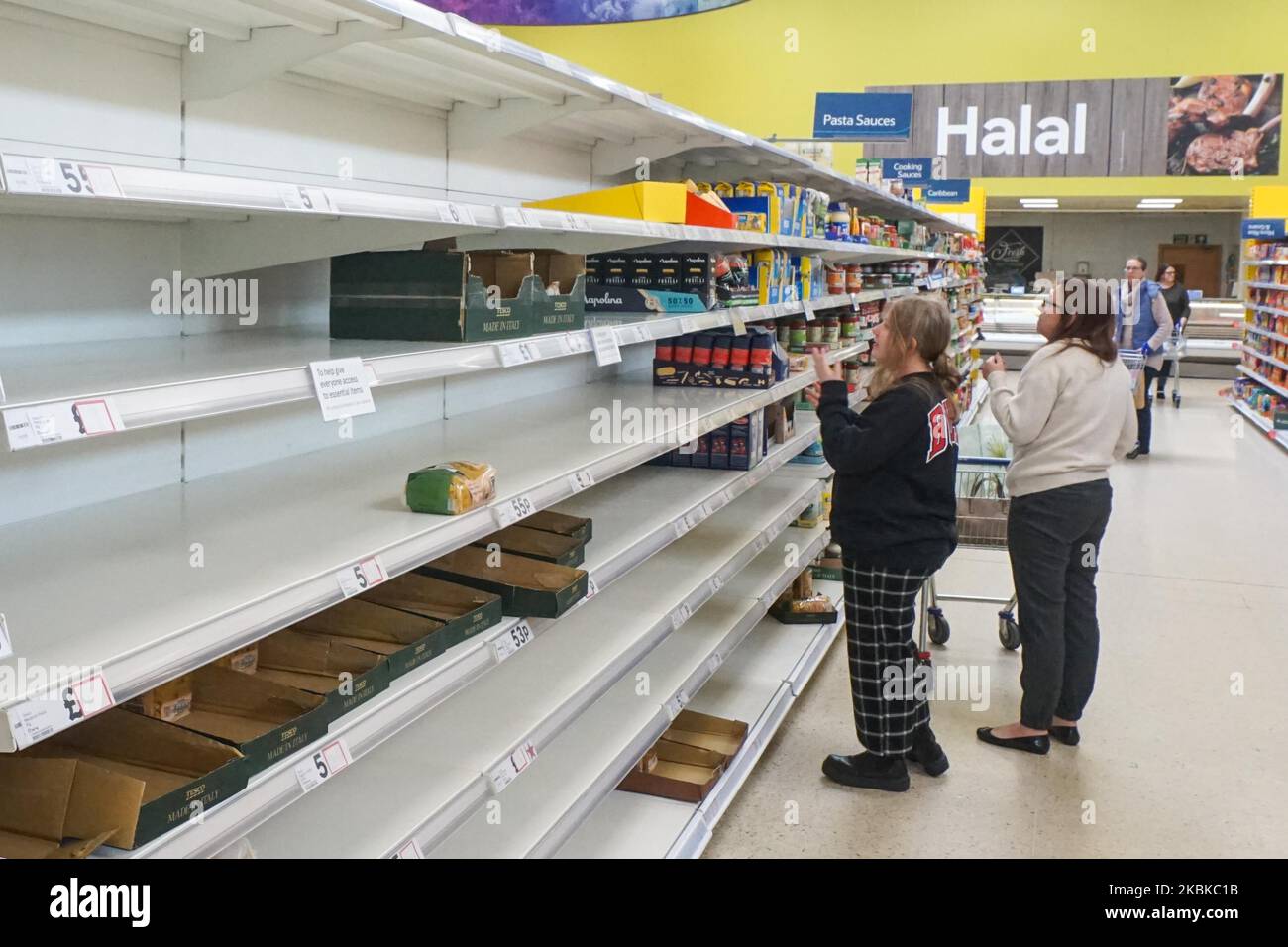Empty shelves of Tesco supermarket as customers look for food in