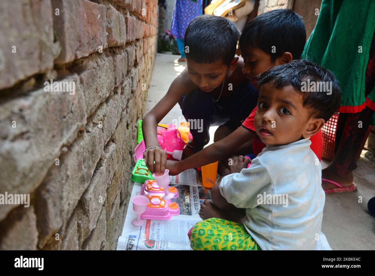 Bangladesh children playing in front of their house at a Mirpur Slum in