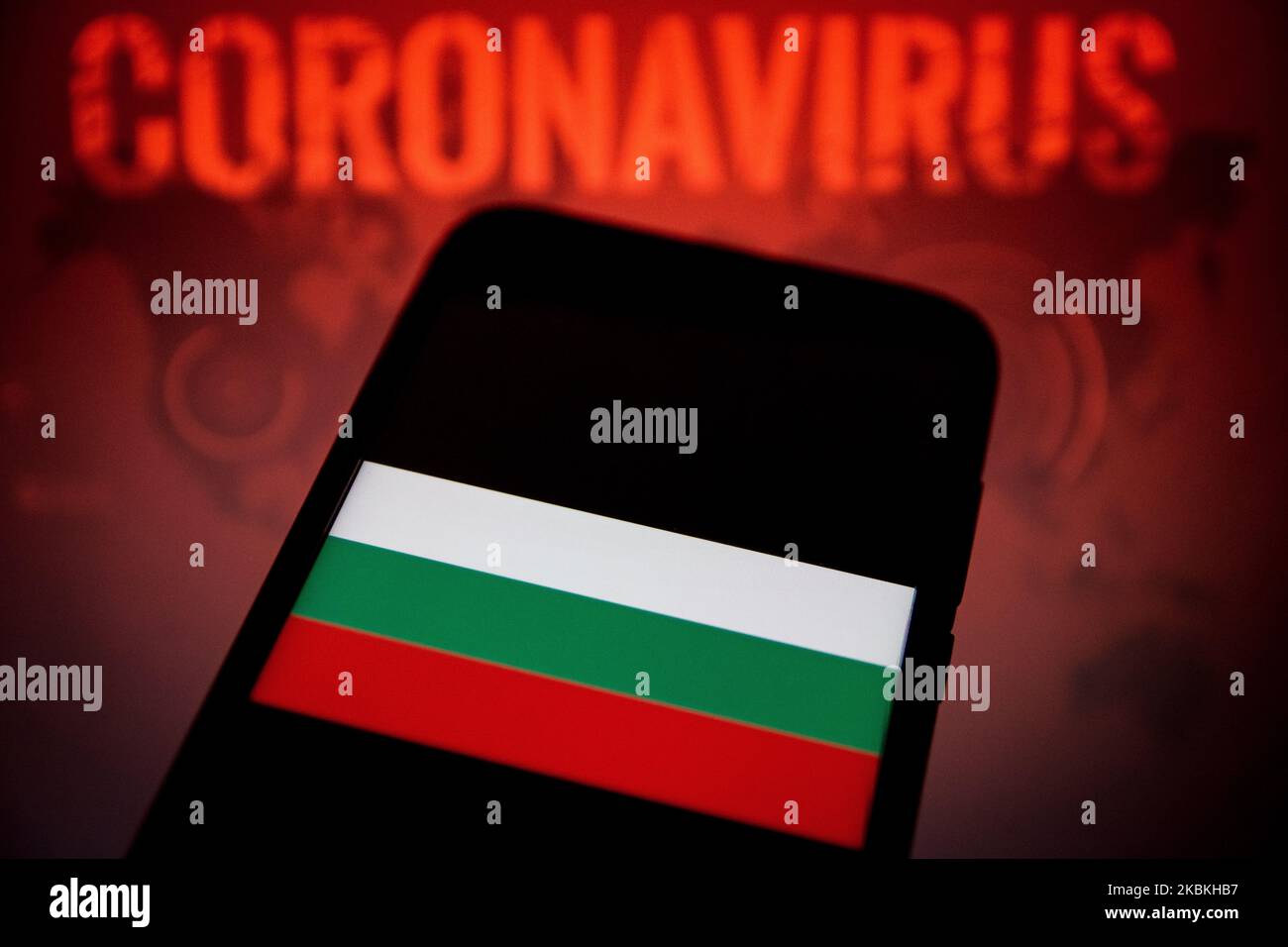 In this photo illustration a Bosnia and Herzegovina flag is displayed on a smartphone with background a Coronavirus picture on March 25, 2020 in Athens, Greece. (Photo by Nikolas Kokovlis/NurPhoto) Stock Photo