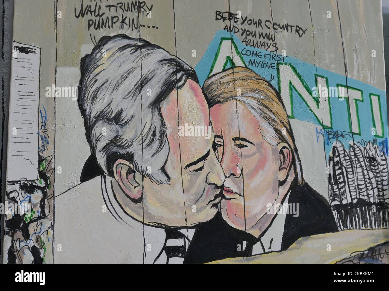 A mural depicting US President Donald Trump and Israel's Prime Minister Benjamin Netanyahu kissing each other seen among other political and social mural paintings and graffitis on the wall separting Israel and the West Bank in Bethlehem. On Thursday, March 5, 2020, in Bethlehem, Palestine (Photo by Artur Widak/NurPhoto) Stock Photo