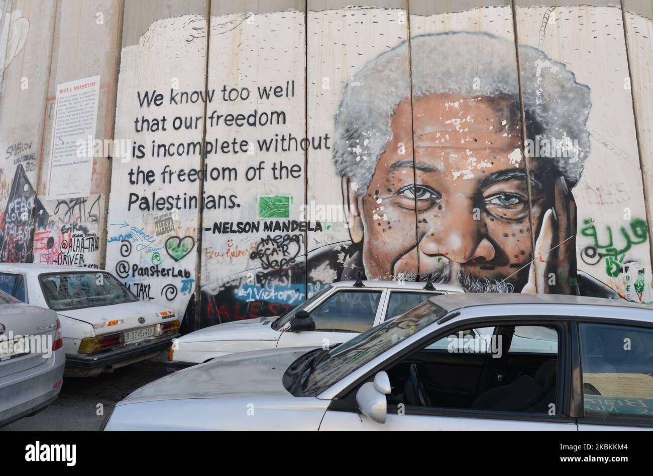 An image of actor Morgan Freeman accompanied by a quote by Nelson Mandela among other political and social mural paintings and graffitis on the wall separting Israel and the West Bank in Bethlehem. On Thursday, March 5, 2020, in Bethlehem, Palestine (Photo by Artur Widak/NurPhoto) Stock Photo