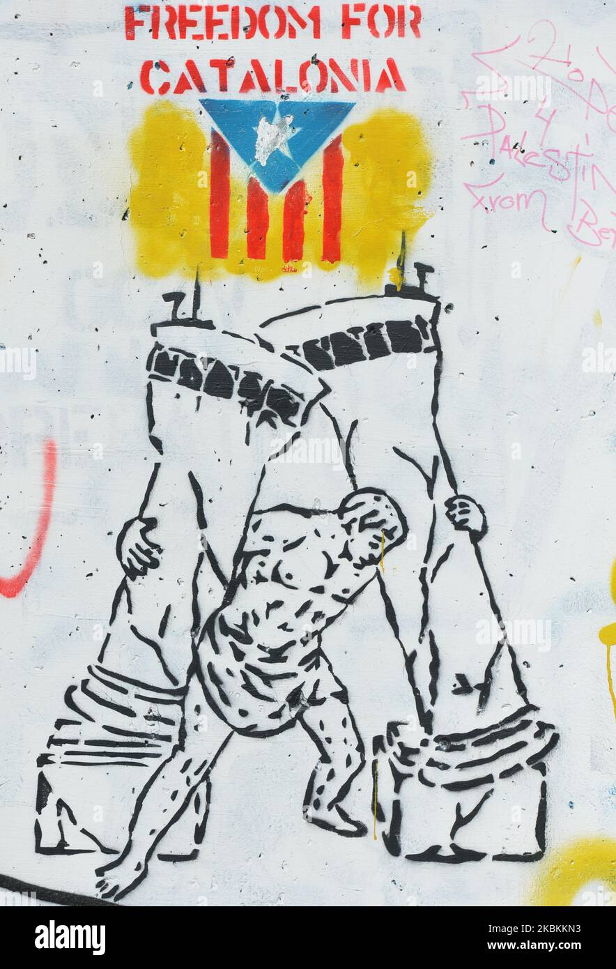 Freedom For Catalonia graffiti among other Political and social mural paintings and graffitis on the wall separting Israel and the West Bank in Bethlehem. On Thursday, March 5, 2020, in Bethlehem, Palestine (Photo by Artur Widak/NurPhoto) Stock Photo