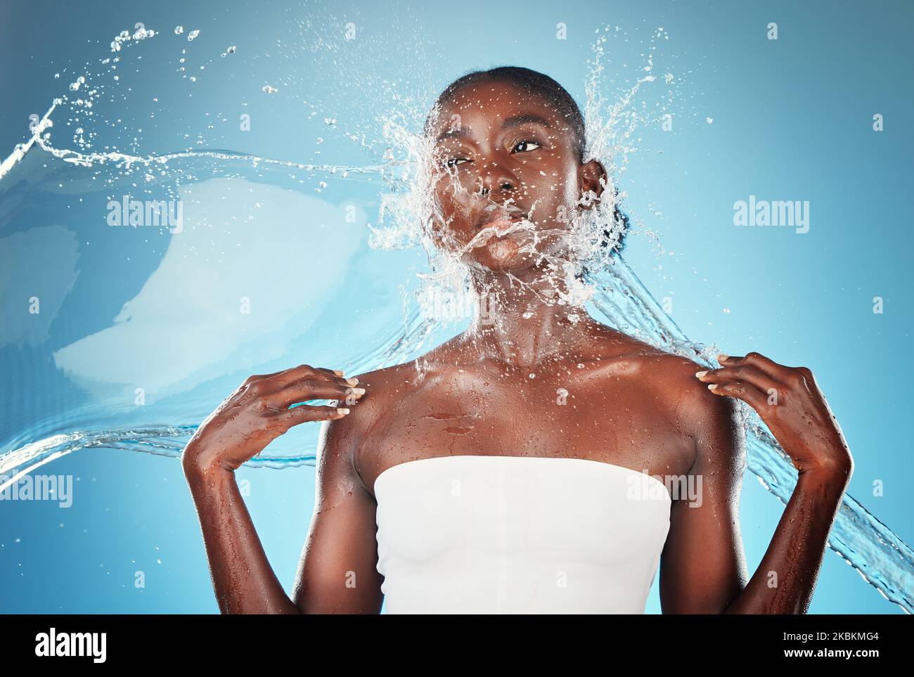 Beauty, splash and skincare with black woman and water for shower, hydration cosmetics and wellness. Health, natural treatment and moisture treatment Stock Photo