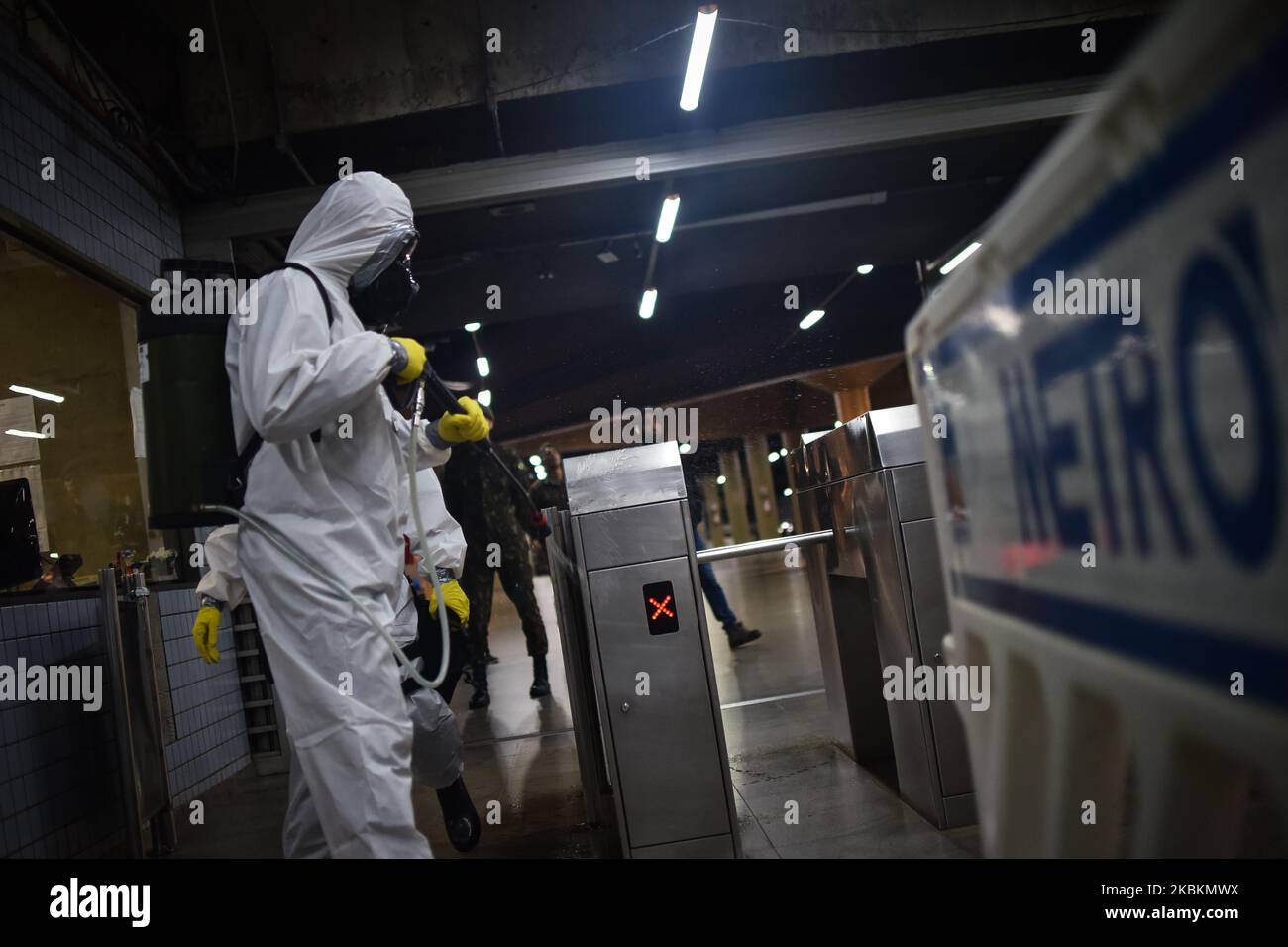 Military soldiers from the Brazilian Army's Chemical, Biological, Radiological and Nuclear Defense Company work on the disinfection of the Central Subway Station in Brasília, Brazil, on March 28, 2020. Decontamination actions in places with high passenger traffic are part of the prevention and fight against the Coronavirus (COVID-19). (Photo by Andre Borges/NurPhoto) Stock Photo