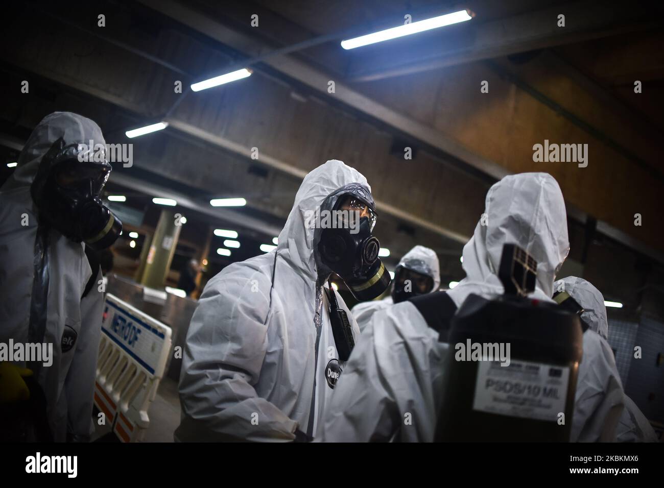 Military soldiers from the Brazilian Army's Chemical, Biological, Radiological and Nuclear Defense Company work on the disinfection of the Central Subway Station in Brasília, Brazil, on March 28, 2020. Decontamination actions in places with high passenger traffic are part of the prevention and fight against the Coronavirus (COVID-19). (Photo by Andre Borges/NurPhoto) Stock Photo