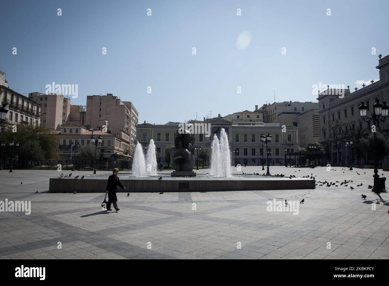 An empty square with a fountain during the nationwide lockdown to contain the spread of the Coronavirus disease, in central Athens, Greece on March 30, 2020. (Photo by Nikolas Kokovlis/NurPhoto) Stock Photo