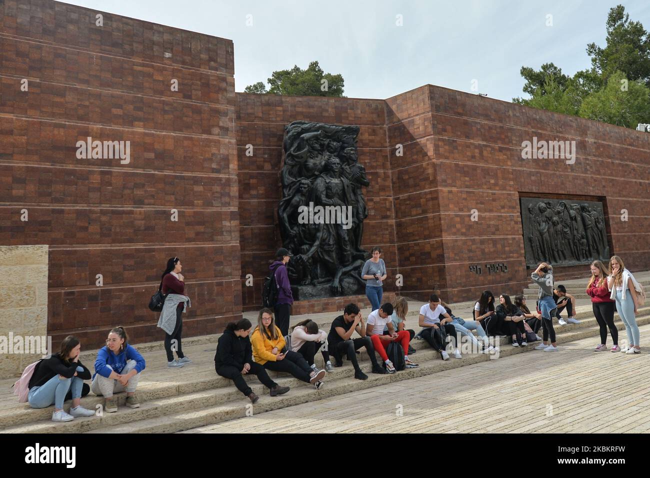The Wall of Remembrance, with two sculptures set in a wall of red