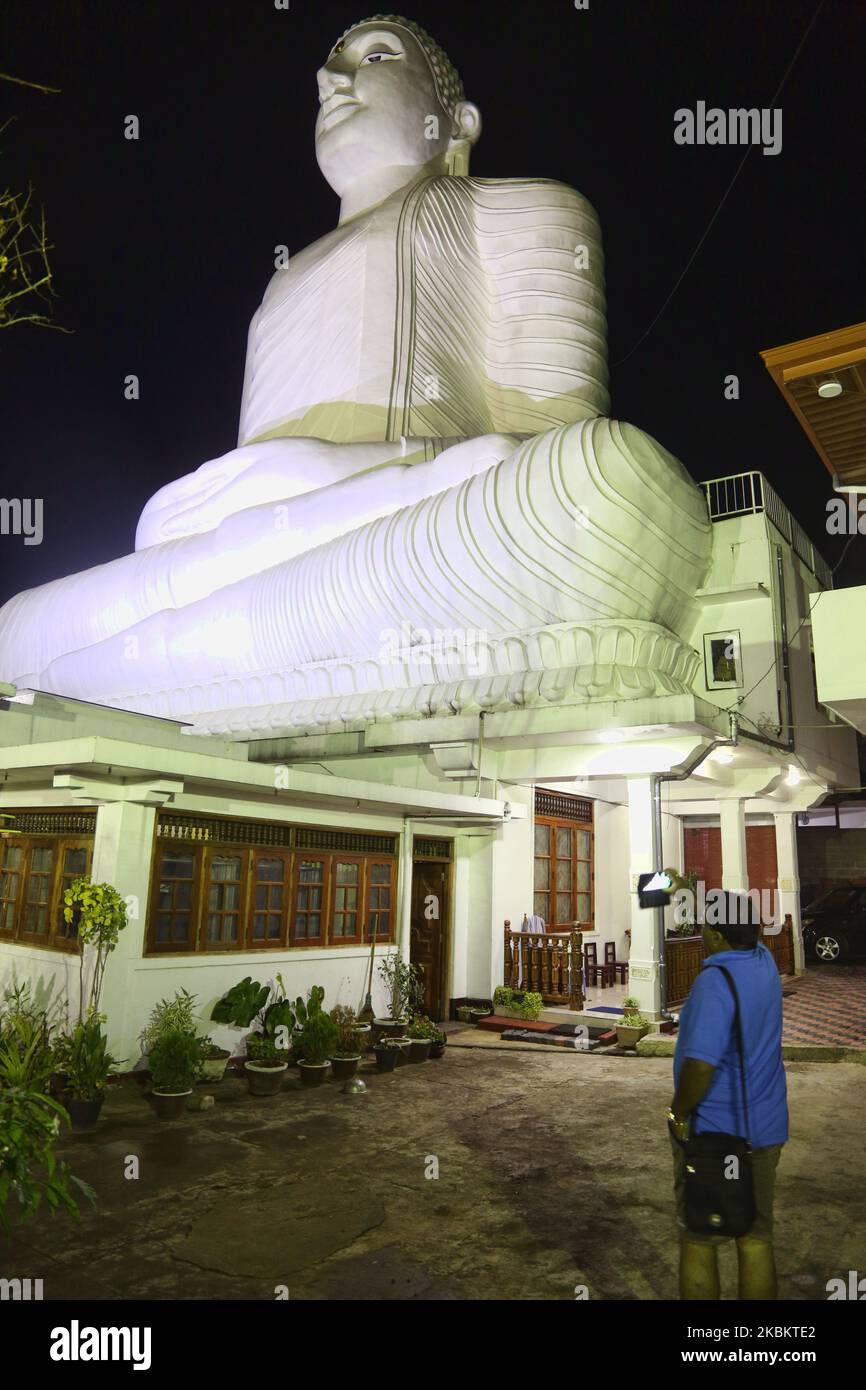 The giant Bahiravokanda Vihara Buddha Statue illuminated at night at