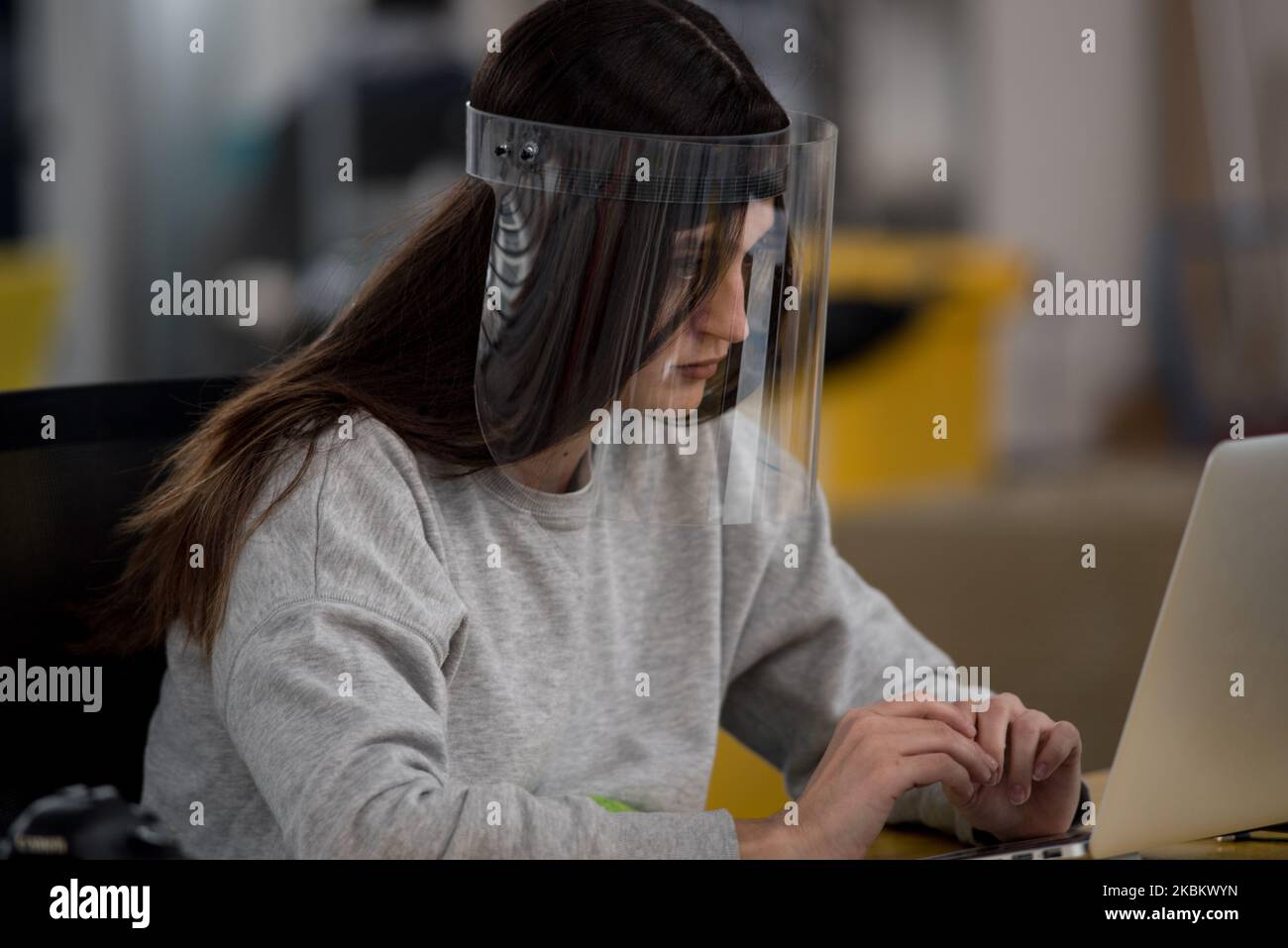 Francesca Moretti, daughter of the founder of the World's Advanced Saving Project, is wearing one of the protective devices designed and produced during the coronavirus crisis. Massa Lombarda, Italy, March 31, 2020. (Photo by Andrea Neri/NurPhoto) Stock Photo