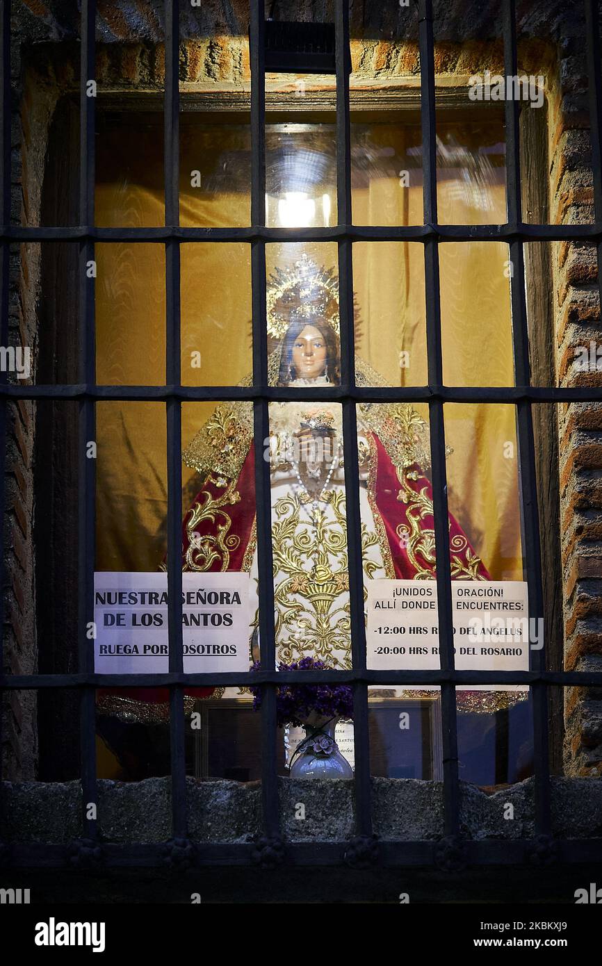 Altar to the Virgin Mary. At Ermita de Nuestra Senora de los Santos, a small image of the Virgen Mary has been placed in one of the windows to pray for the sick people in Mostoles, Spain. April 02, 2020. (Photo by A. Ware/NurPhoto) Stock Photo