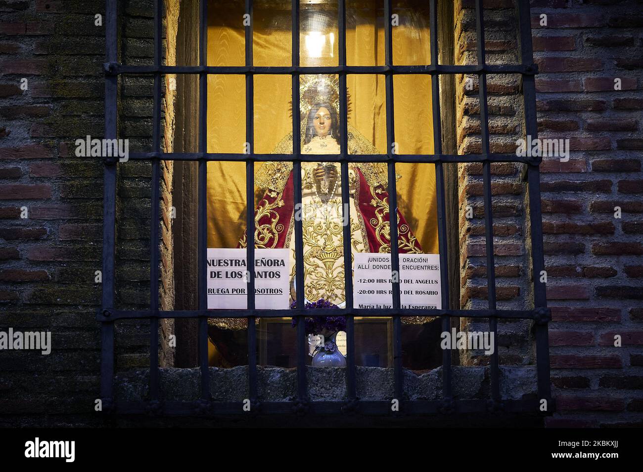 Altar to the Virgin Mary. At Ermita de Nuestra Senora de los Santos, a small image of the Virgen Mary has been placed in one of the windows to pray for the sick people in Mostoles, Spain. April 02, 2020. (Photo by A. Ware/NurPhoto) Stock Photo