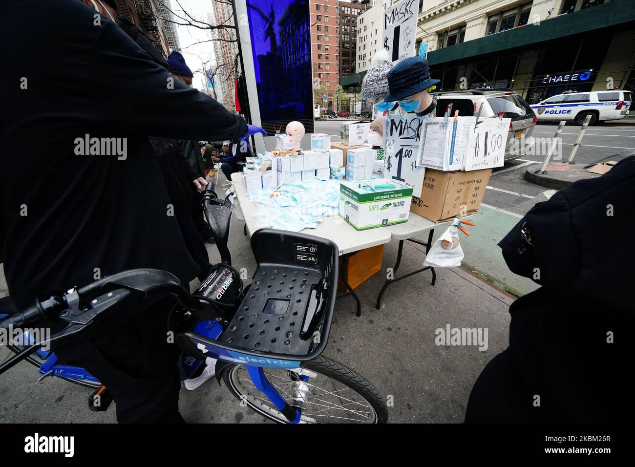 A person on Citibike is seen purchasing surgical masks and gloves to combat Coronavirus Pandemic on April 5, 2020. (Photo by John Nacion/NurPhoto) Stock Photo