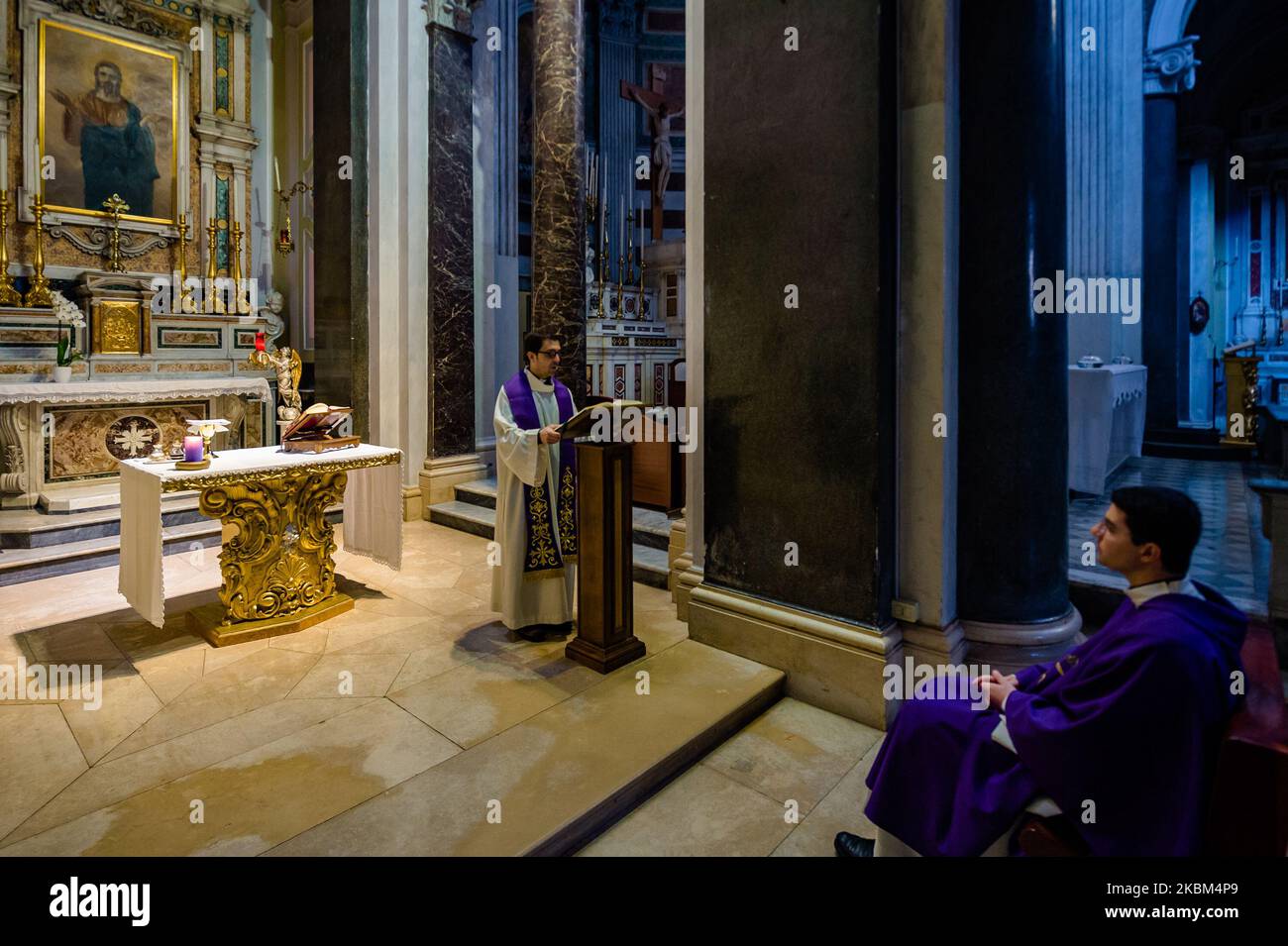 Priests Don Nico Tempesta and Don Antonio Picca hold daily mass in the Immaculate Church of Molfetta behind closed doors during the coronavirus emergency period on April 8, 2020 (Photo by Davide Pischettola/NurPhoto) Stock Photo