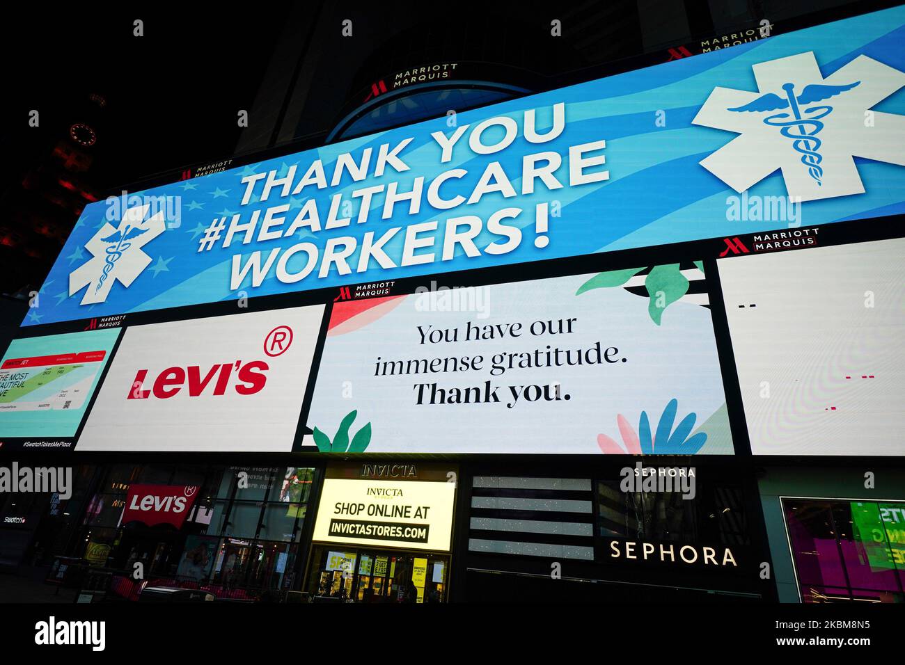 Digital billboard flashes signs of support for medical workers in Time