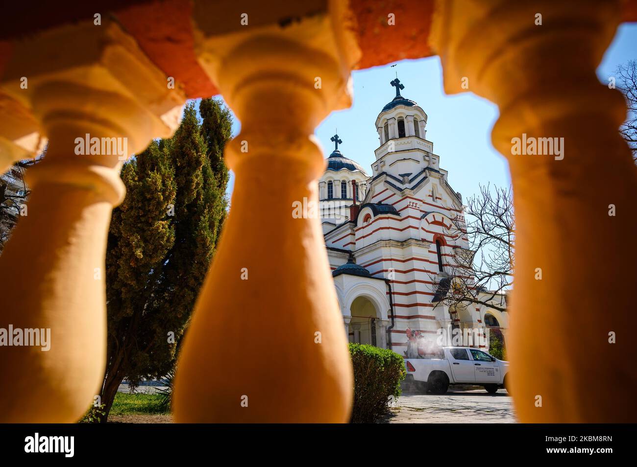 Cleaning specialists carry out desinfection of the interior and exterior of a church in the town ov Varna (some 450 km to the East of the Bulgarian capital Sofia) on April 10th, 2020. On April 11 and April 12 the Bulgarians celebrate St. Lazurus Day and Palm Sunday. Due to coronavirus outbreak all holy masses will be held outside of the temples. People are still allowed to attend at churches, though. More than 600 Bulgarians are ill with Covid-19 and more than 20 died since the beginnig of the pandemy. (Photo by Petko Momchilov/Impact Press Group/NurPhoto) Stock Photo