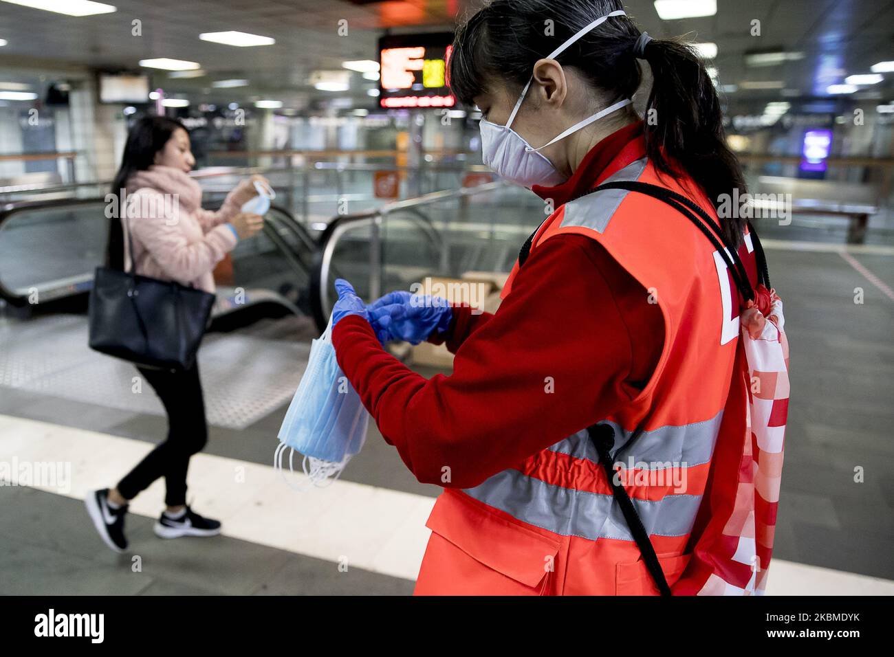 Red Cross volunteers have started to distribute more than a million health masks for free in Barcelona's metro and train stations on the occasion of the Coronavirus Covid 19 health crisis in Barcelona, Catalonia, Spain, on April 14, 2020. (Photo by Miquel Llop/NurPhoto) Stock Photo