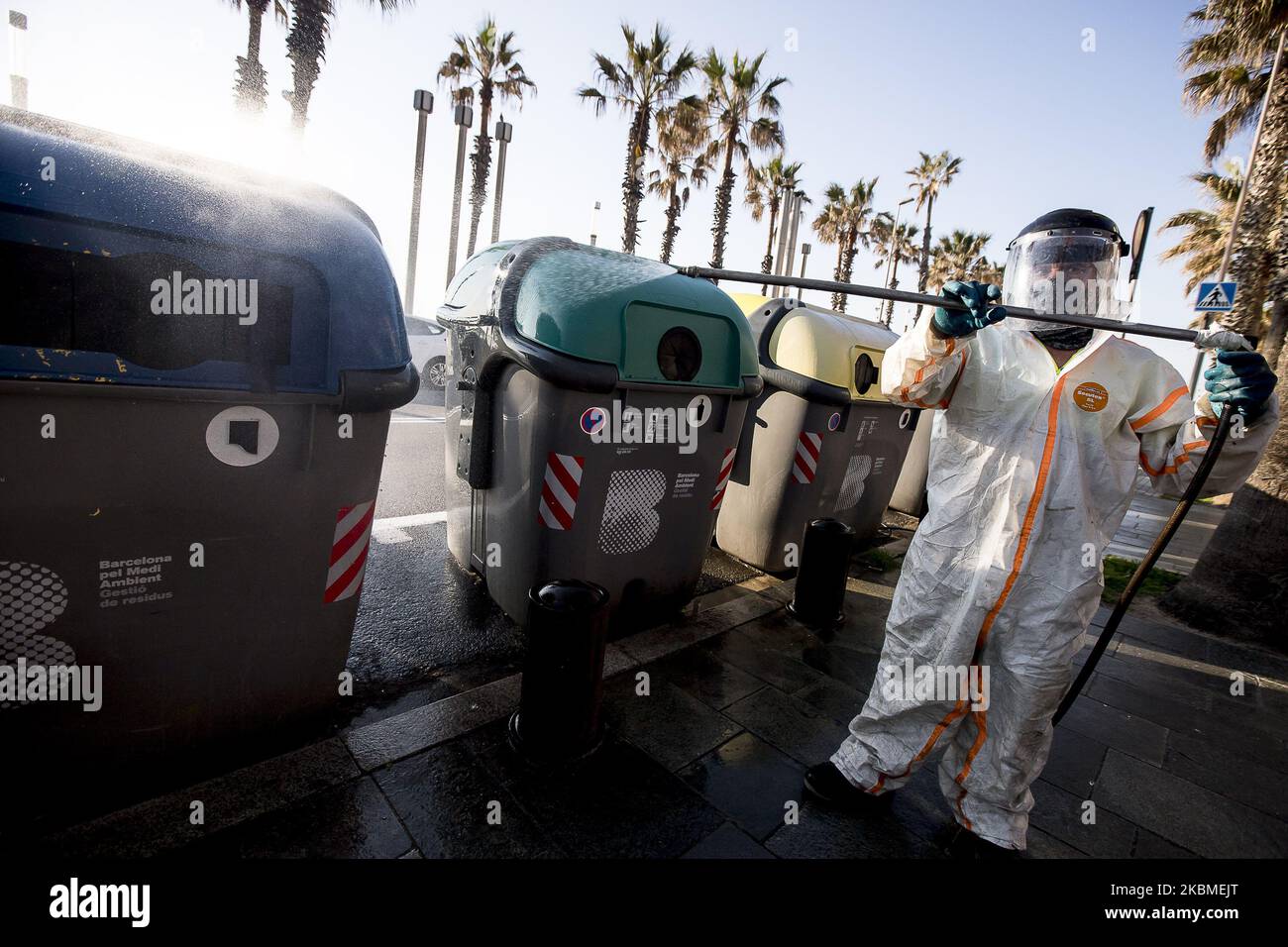 Members of the Barcelona Municipal Brigade disinfect the city streets during the Coronavirus - Covid19 crisis in Barcelona, Catalonia, Spain on April 10, 2020 (Photo by Miquel Llop/NurPhoto) Stock Photo