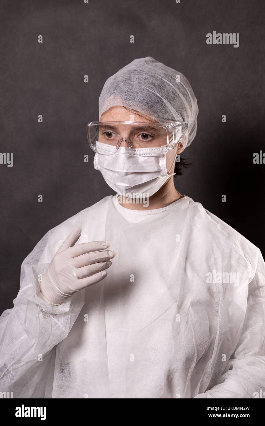 For illustration purposes woman wears Personal Protective Equipment