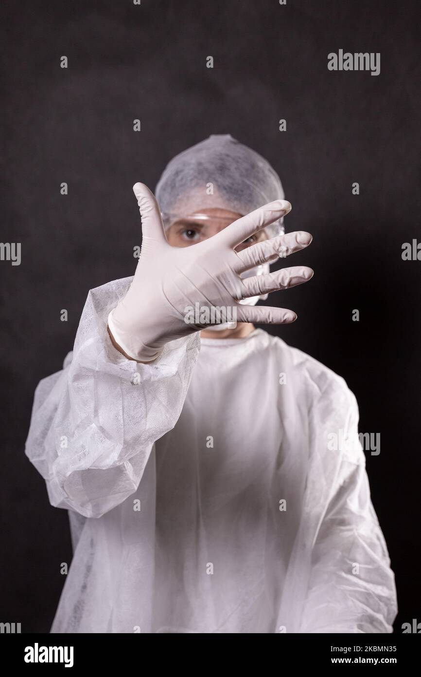 For illustration purposes woman wears Personal Protective Equipment