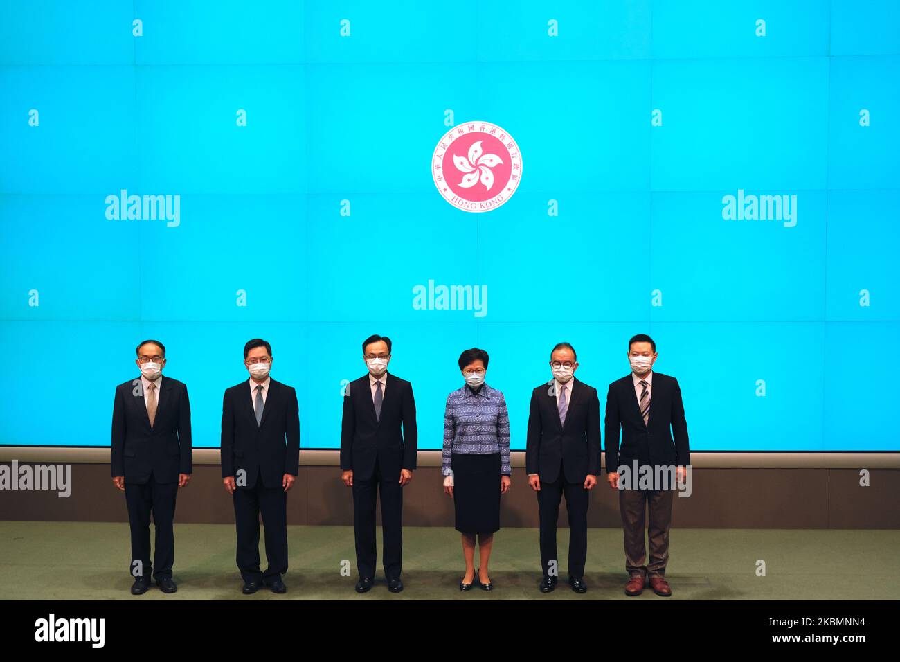 From Left to Right Mr. Alfred Sit Wing-hang, Mr. Christopher Hui Ching-yu, Mr. Patrick Nip Tak-Kuen, Chief Executive Carrie Lam Cheng Yuet-Ngor, Mr. Erick Tsang Kwok-wai, Mr. Caspar Ying-wai Tsui poes for a photo inside the Central Government Office on April 22, 2020 in Hong Kong, China. The Hong Kong Government has announced a cabinet reshuffle . (Photo by Vernon Yuen/NurPhoto) Stock Photo