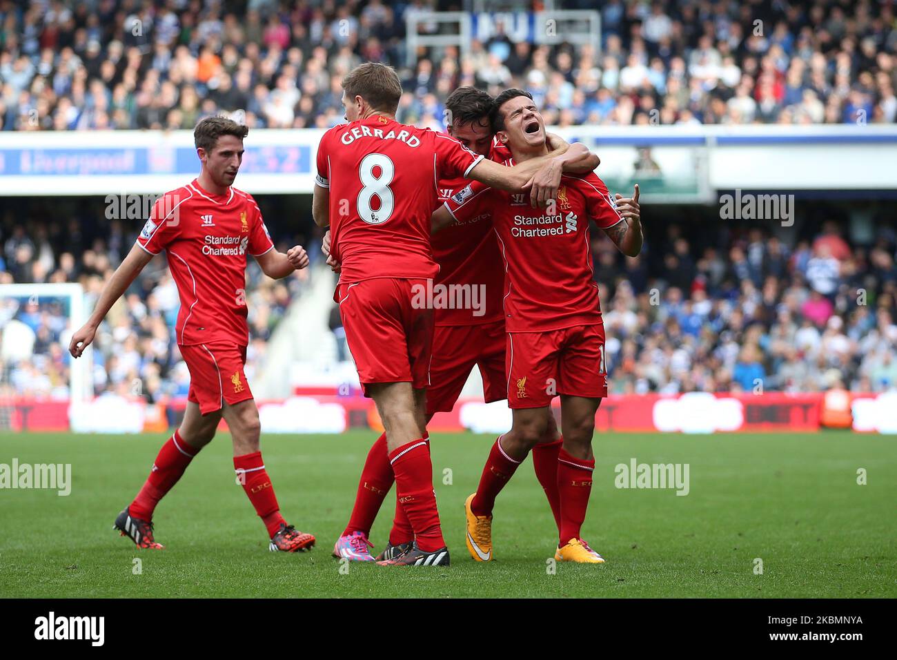 Liverpool Midfielder Philippe Coutinho celebrates with his team mates after he scores making it 1-2 in the second half during the Barclays Premier League Match between Queens Park Rangers & Liverpool at Loftus Road, London on Sunday October 19th 2014 (Photo by MI News/NurPhoto) Stock Photo