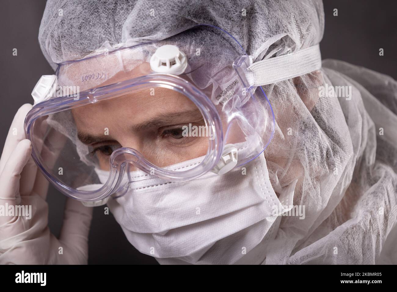 For illustration purposes woman wears Personal Protective Equipment
