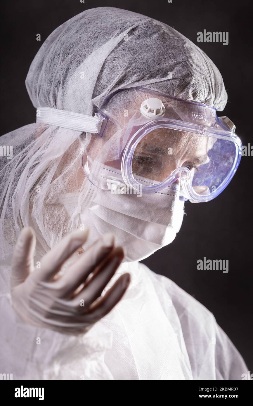 For illustration purposes woman wears Personal Protective Equipment