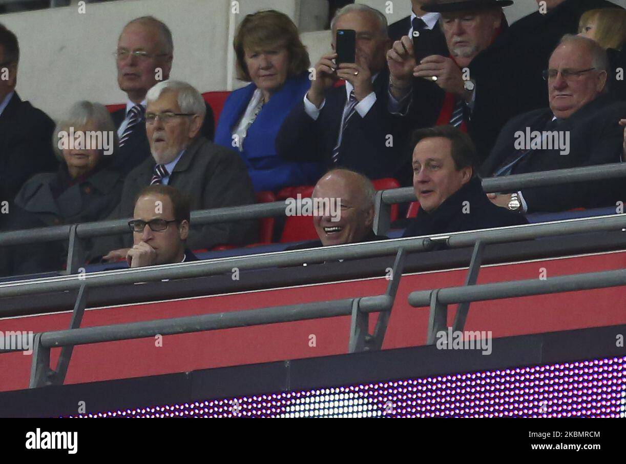 HRH Prince William looks on pensively as Greg Dyke (c), the Chairman of the Football Association and David Cameron (R), the Bristish Prime Minister share a joke during the International Friendly match between England & France at Wembley Stadium on Tuesday 17th November2015. (Photo by Ryan Dinham/MI News/NurPhoto) Stock Photo