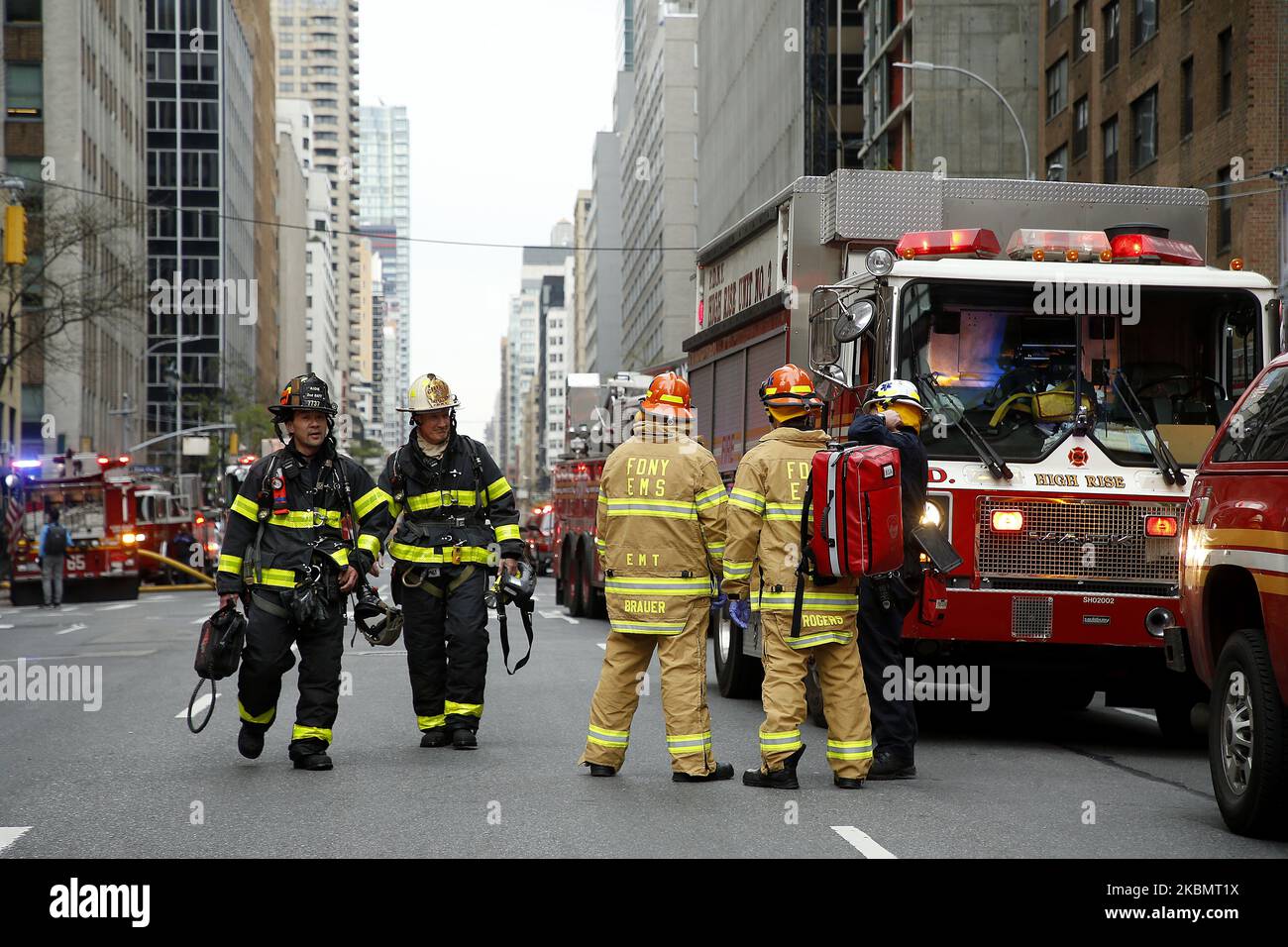 Emergency Services Rescue Personnel and Firemen in New York, on April 23, 2020. New York Fire Department and Emergency services technicians were dispatched to a high-rise in New York City on April 23, 2020. Scores of firetrucks, ambulances and EMT rescue medics stood ready in front of Murray Hill towers on 2nd Avenue. (Photo by John Lamparski/NurPhoto) Stock Photo