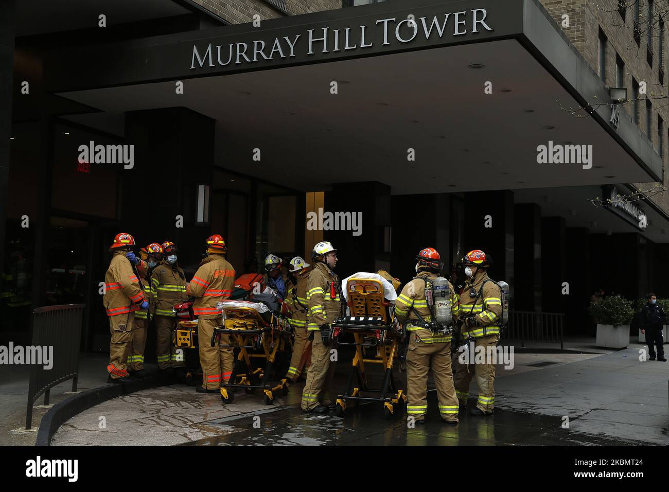 Emergency Services Rescue Personnel in New York, on April 23, 2020. New York Fire Department and Emergency services technicians were dispatched to a high-rise in New York City on April 23, 2020. Scores of firetrucks, ambulances and EMT rescue medics stood ready in front of Murray Hill towers on 2nd Avenue. (Photo by John Lamparski/NurPhoto) Stock Photo