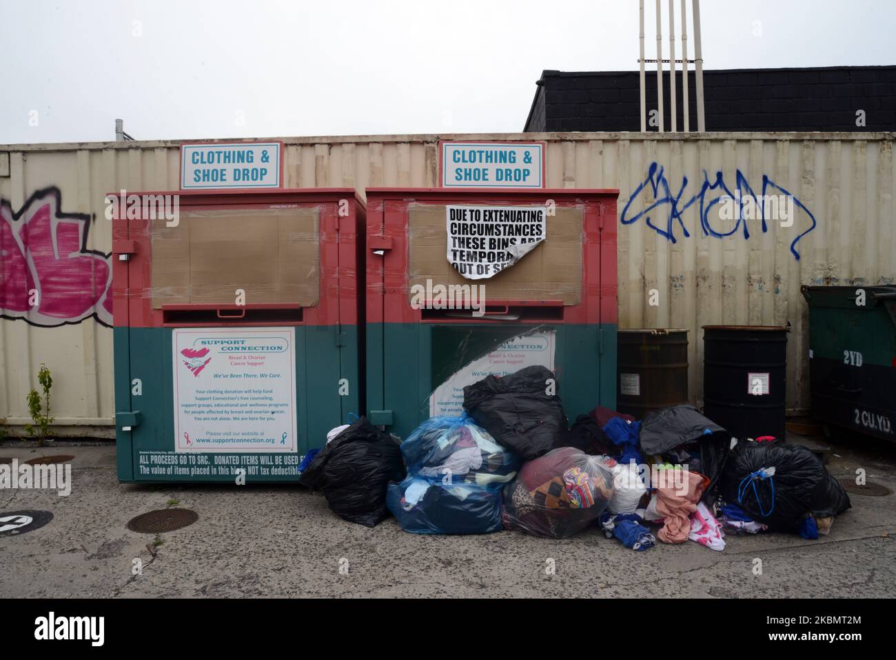 Donations of clothing pile up at a disabled clothing/shoe drop in Queens, New York, Thursday, 23