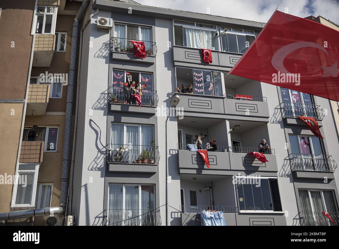 People celebrate with Turkish flags on their balconies to mark the National Sovereignty and Children's Day during a lockdown in Istanbul, Turkey, 23 April 2020. The Turkish Ministry of Interior announced that Istanbul and 30 major cities will be under lockdown from 23 until 26 April 2020 amid the ongoing coronavirus COVID-19 pandemic. Turkey suspended all international flights and all inter-city travels are subject to local authorities' permission as part of measures to prevent the spread of the pandemic COVID-19 disease caused by the SARS-CoV-2 coronavirus. (Photo by Cem TekkeÅŸinoÄŸlu/NurPho Stock Photo