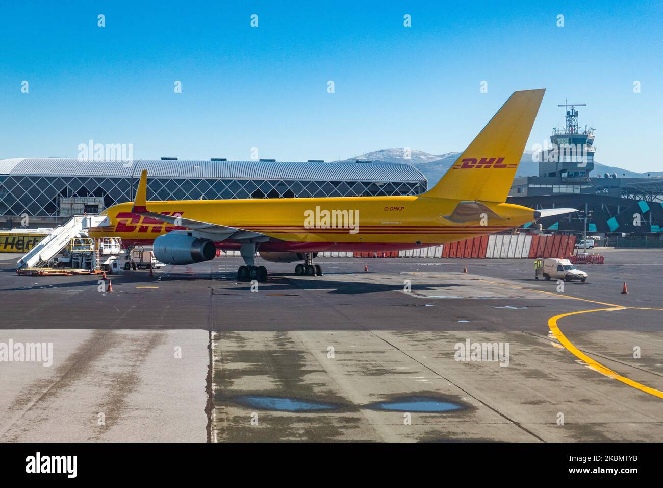 DHL Air Boeing 757 Cargo airplane as seen during the day with the cargo door open at Thessaloniki International Airport Makedonia SKG LGTS in Greece. The Boeing B757 or 757-200F freight aircraft has the registration G-DHKP and is powered by 2x Roll Royce RR jet engines. DHL Aviation is a division of DHL Express owned by Deutsche Post and is an Express Logistics air freight carrier. During the Covid-19 Coronavirus pandemic, most of the passenger airlines grounded their fleet but the cargo airlines increased the flights to transport goods and supplies. March 16, 2020 (Photo by Nicolas Economou/N Stock Photo