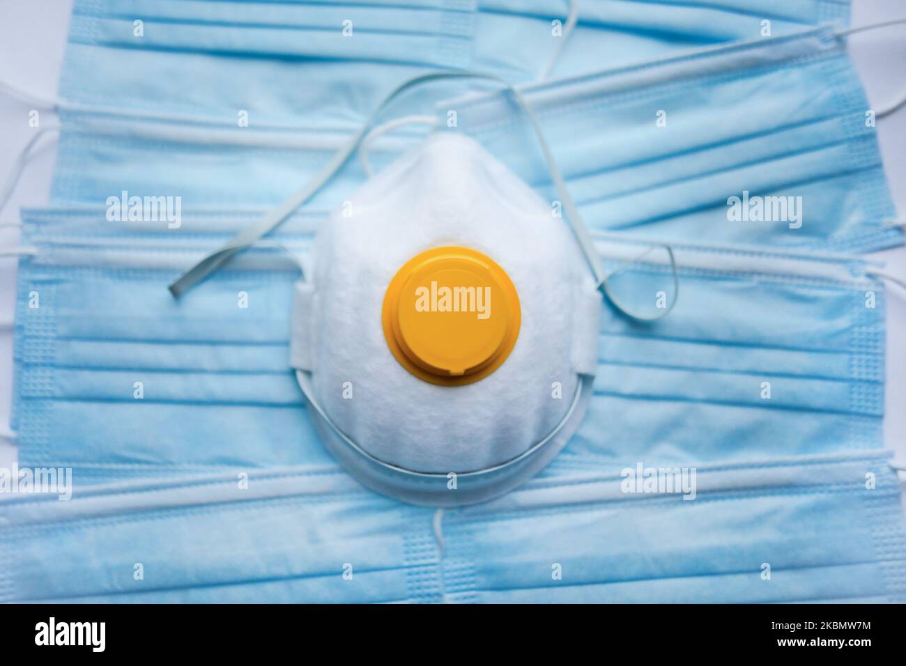 A FFP1 face mask is photographed on surgical masks background for