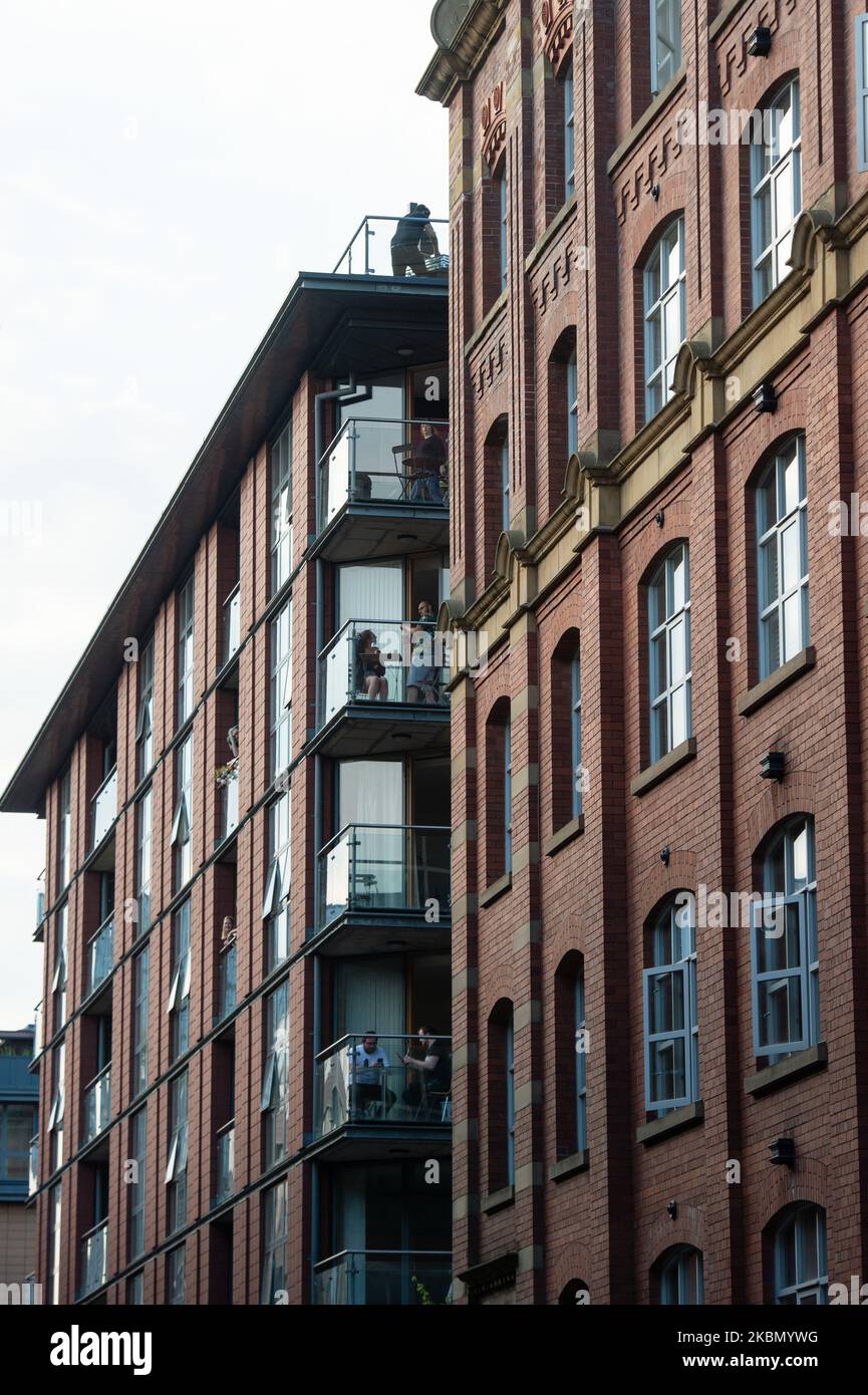 The Ancoats district of Manchester comes to a standstill as DJ Coast2Coast puts on a short DJ set on the top of one of the residential buildings. He is raising funds for The Samaritans and Cyclists Fighting Cancer. On April 25, 2020 in Manchester, UK. (Photo by Pat Scaasi/MI News/NurPhoto) Stock Photo